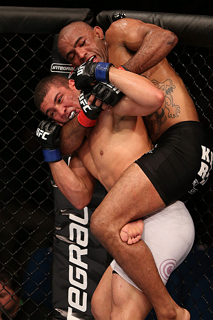 RIO DE JANEIRO, BRAZIL - OCTOBER 13:  (R-L) Sergio Moraes secures a rear choke submission against Renee Forte during their welterweight fight at UFC 153 inside HSBC Arena on October 13, 2012 in Rio de Janeiro, Brazil.  (Photo by Josh Hedges/Zuffa LLC/Zuffa LLC via Getty Images)