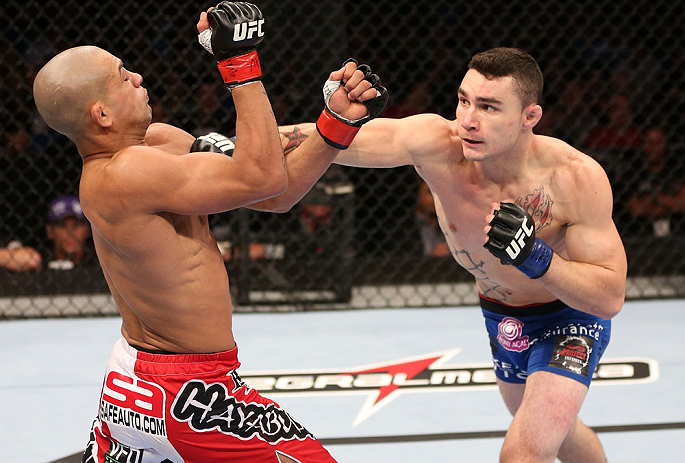 RIO DE JANEIRO, BRAZIL - OCTOBER 13:  (R-L) Joey Gambino punches Diego Brandao during their featherweight fight at UFC 153 inside HSBC Arena on October 13, 2012 in Rio de Janeiro, Brazil.  (Photo by Josh Hedges/Zuffa LLC/Zuffa LLC via Getty Images)