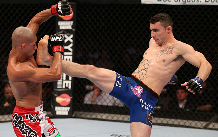 RIO DE JANEIRO, BRAZIL - OCTOBER 13:  (R-L) Joey Gambino kicks Diego Brandao during their featherweight fight at UFC 153 inside HSBC Arena on October 13, 2012 in Rio de Janeiro, Brazil.  (Photo by Josh Hedges/Zuffa LLC/Zuffa LLC via Getty Images)