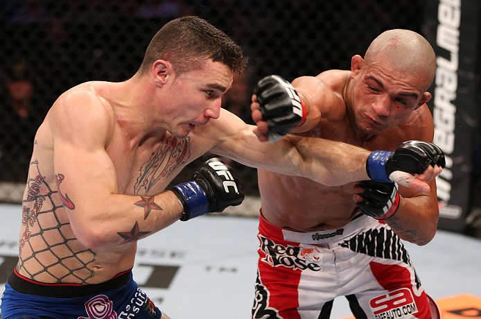 RIO DE JANEIRO, BRAZIL - OCTOBER 13:  (R-L) Diego Brandao punches Joey Gambino during their featherweight fight at UFC 153 inside HSBC Arena on October 13, 2012 in Rio de Janeiro, Brazil.  (Photo by Josh Hedges/Zuffa LLC/Zuffa LLC via Getty Images)