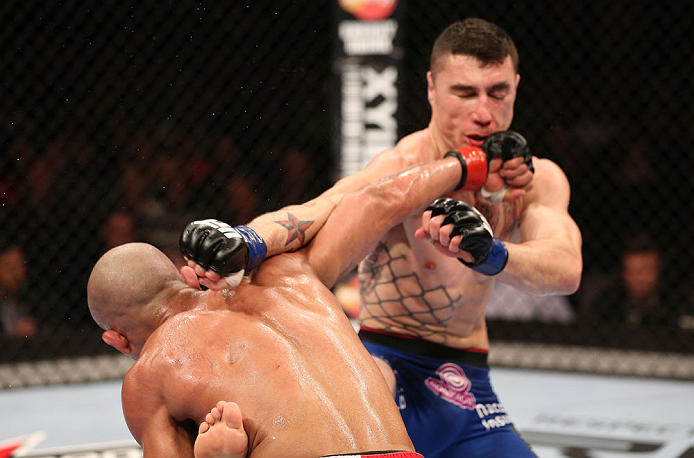 RIO DE JANEIRO, BRAZIL - OCTOBER 13:  (L-R) Diego Brandao punches Joey Gambino during their featherweight fight at UFC 153 inside HSBC Arena on October 13, 2012 in Rio de Janeiro, Brazil.  (Photo by Josh Hedges/Zuffa LLC/Zuffa LLC via Getty Images)