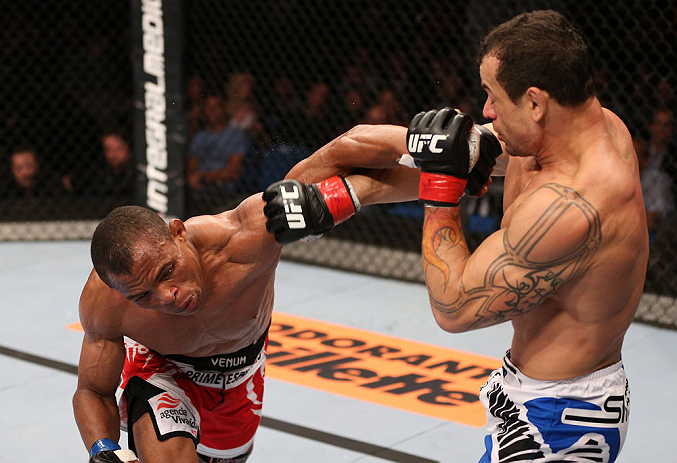 RIO DE JANEIRO, BRAZIL - OCTOBER 13:  (L-R) Francisco Trinaldo punches Gleison Tibau during their lightweight fight at UFC 153 inside HSBC Arena on October 13, 2012 in Rio de Janeiro, Brazil.  (Photo by Josh Hedges/Zuffa LLC/Zuffa LLC via Getty Images)