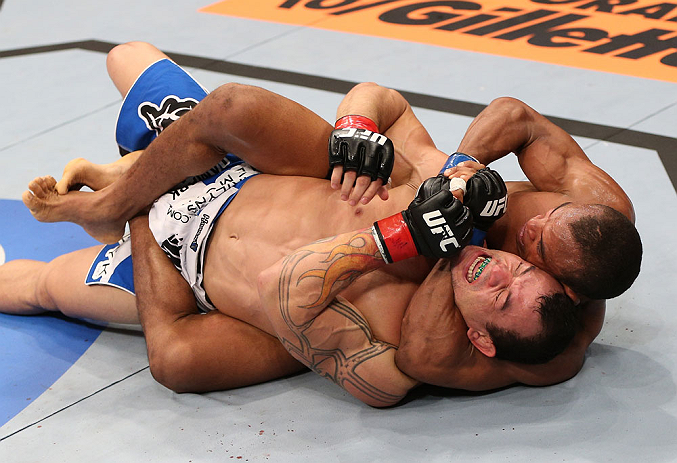 RIO DE JANEIRO, BRAZIL - OCTOBER 13:  (R-L) Francisco Trinaldo attempts a choke submission against Gleison Tibau during their lightweight fight at UFC 153 inside HSBC Arena on October 13, 2012 in Rio de Janeiro, Brazil.  (Photo by Josh Hedges/Zuffa LLC/Zuffa LLC via Getty Images)