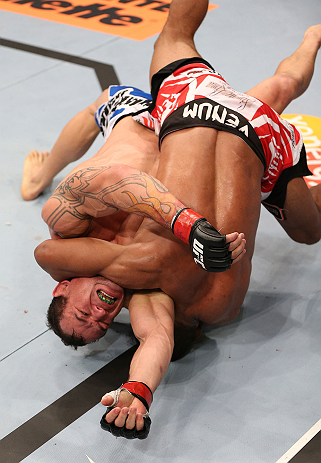 RIO DE JANEIRO, BRAZIL - OCTOBER 13:  (L-R) Gleison Tibau fights to escape a choke by Francisco Trinaldo during their lightweight fight at UFC 153 inside HSBC Arena on October 13, 2012 in Rio de Janeiro, Brazil.  (Photo by Josh Hedges/Zuffa LLC/Zuffa LLC via Getty Images)