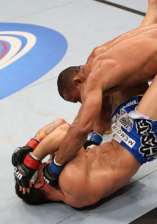 RIO DE JANEIRO, BRAZIL - OCTOBER 13:  (R-L) Francisco Trinaldo punches Gleison Tibau during their lightweight fight at UFC 153 inside HSBC Arena on October 13, 2012 in Rio de Janeiro, Brazil.  (Photo by Josh Hedges/Zuffa LLC/Zuffa LLC via Getty Images)