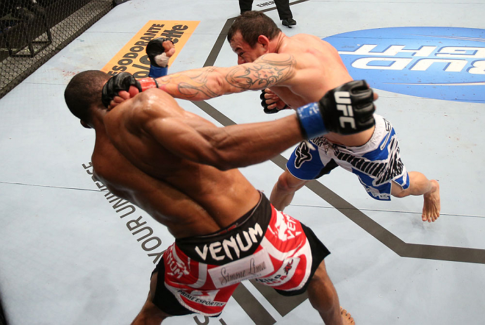 RIO DE JANEIRO, BRAZIL - OCTOBER 13:  (R-L) Gleison Tibau punches Francisco Trinaldo during their lightweight fight at UFC 153 inside HSBC Arena on October 13, 2012 in Rio de Janeiro, Brazil.  (Photo by Josh Hedges/Zuffa LLC/Zuffa LLC via Getty Images)