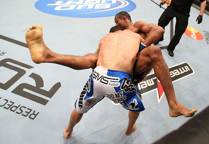 RIO DE JANEIRO, BRAZIL - OCTOBER 13:  (L-R) Gleison Tibau takes down Francisco Trinaldo during their lightweight fight at UFC 153 inside HSBC Arena on October 13, 2012 in Rio de Janeiro, Brazil.  (Photo by Josh Hedges/Zuffa LLC/Zuffa LLC via Getty Images)