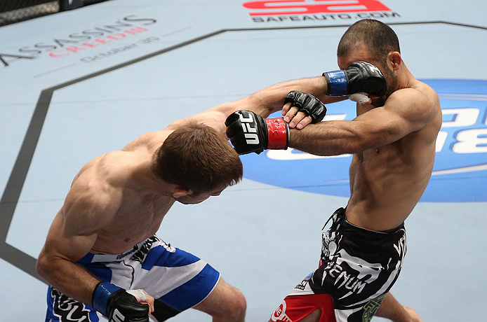 MINNEAPOLIS, MN - OCTOBER 05:  (L-R) Phil Harris punches Darren Uyenoyama during their flyweight fight at the UFC on FX event at Target Center on October 5, 2012 in Minneapolis, Minnesota.  (Photo by Josh Hedges/Zuffa LLC/Zuffa LLC via Getty Images)