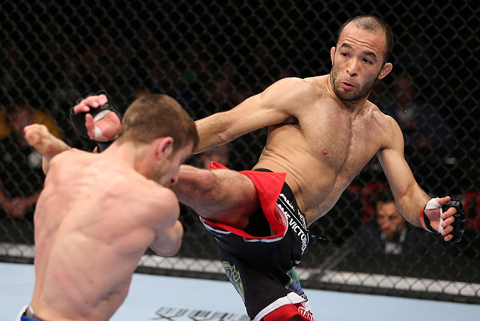MINNEAPOLIS, MN - OCTOBER 05: (R-L) Darren Uyenoyama kicks Phil Harris during their flyweight fight at the UFC on FX event at Target Center on October 5, 2012 in Minneapolis, Minnesota. (Photo by Josh Hedges/Zuffa LLC/Zuffa LLC via Getty Images)