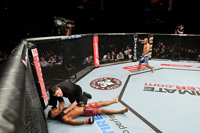 NOTTINGHAM, ENGLAND - SEPTEMBER 29: Robbie Peralta (R) reacts after knocking out Jason Young during their featherweight fight at the UFC on Fuel TV event at Capital FM Arena on September 29, 2012 in Nottingham, England. (Photo by Josh Hedges/Zuffa LLC/Zuffa LLC via Getty Images)