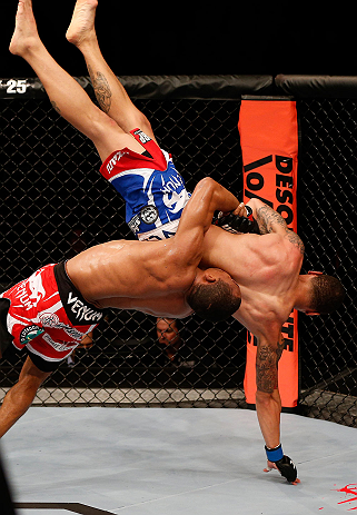 SAO PAULO, BRAZIL - JANUARY 19: (L-R) Francisco Trinaldo slams C.J. Keith in their lightweight fight at the UFC on FX event on January 19, 2013 at Ibirapuera Gymnasium in Sao Paulo, Brazil. (Photo by Josh Hedges/Zuffa LLC/Zuffa LLC via Getty Images)
