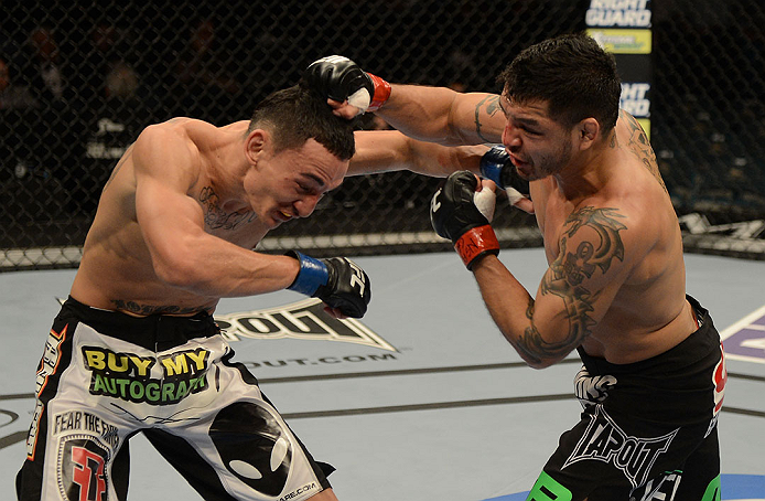 LAS VEGAS, NV - DECEMBER 29:  (R-L) Leonard Garcia punches Max Holloway during their featherweight fight at UFC 155 on December 29, 2012 at MGM Grand Garden Arena in Las Vegas, Nevada. (Photo by Donald Miralle/Zuffa LLC/Zuffa LLC via Getty Images) *** Local Caption *** Leonard Garcia; Max Holloway