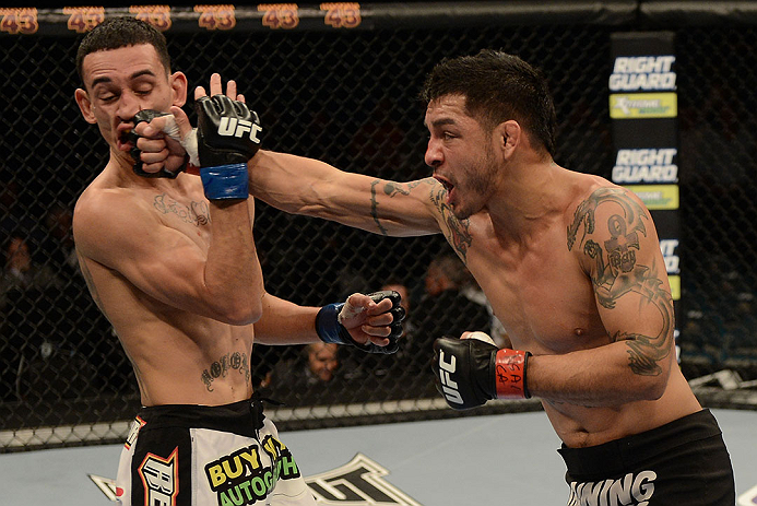 LAS VEGAS, NV - DECEMBER 29:  (R-L) Leonard Garcia punches Max Holloway during their featherweight fight at UFC 155 on December 29, 2012 at MGM Grand Garden Arena in Las Vegas, Nevada. (Photo by Donald Miralle/Zuffa LLC/Zuffa LLC via Getty Images) *** Local Caption *** Leonard Garcia; Max Holloway