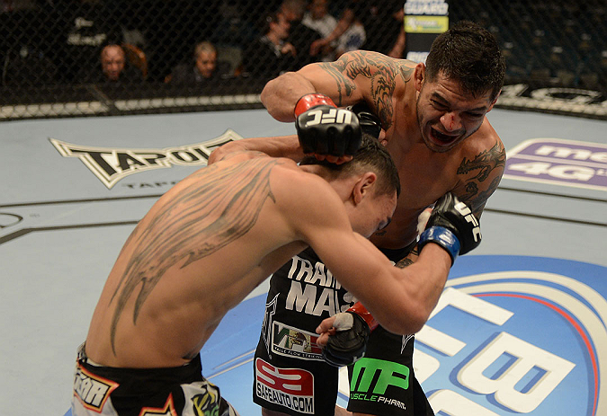 LAS VEGAS, NV - DECEMBER 29:  (R-L) Leonard Garcia punches Max Holloway during their featherweight fight at UFC 155 on December 29, 2012 at MGM Grand Garden Arena in Las Vegas, Nevada. (Photo by Donald Miralle/Zuffa LLC/Zuffa LLC via Getty Images) *** Local Caption *** Leonard Garcia; Max Holloway
