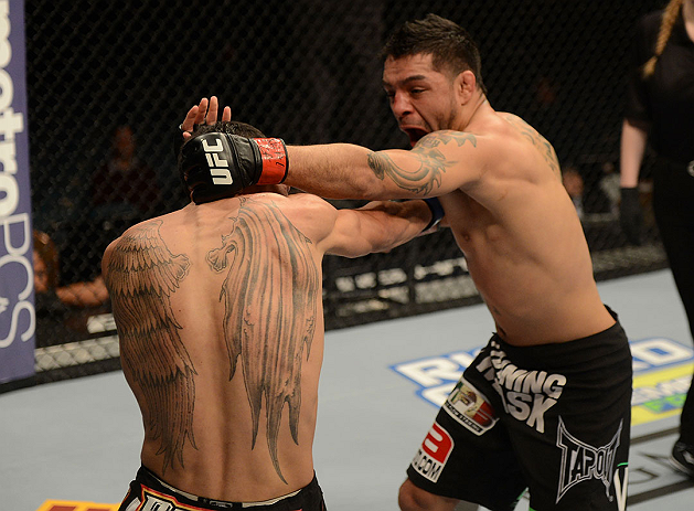LAS VEGAS, NV - DECEMBER 29:  (R-L) Leonard Garcia punches Max Holloway during their featherweight fight at UFC 155 on December 29, 2012 at MGM Grand Garden Arena in Las Vegas, Nevada. (Photo by Donald Miralle/Zuffa LLC/Zuffa LLC via Getty Images) *** Local Caption *** Leonard Garcia; Max Holloway