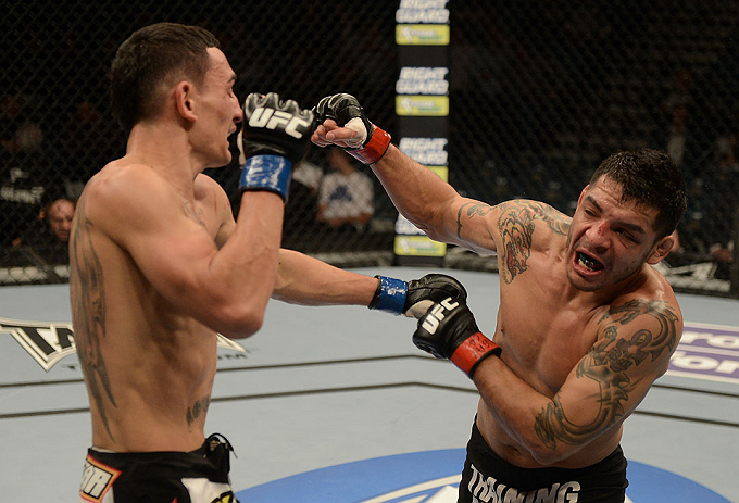 LAS VEGAS, NV - DECEMBER 29:  (R-L) Leonard Garcia punches Max Holloway during their featherweight fight at UFC 155 on December 29, 2012 at MGM Grand Garden Arena in Las Vegas, Nevada. (Photo by Donald Miralle/Zuffa LLC/Zuffa LLC via Getty Images) *** Local Caption *** Leonard Garcia; Max Holloway
