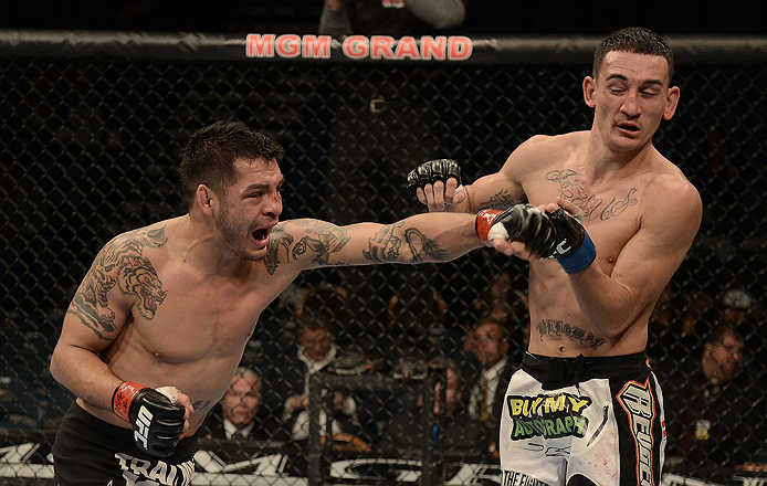 LAS VEGAS, NV - DECEMBER 29:  (L-R) Leonard Garcia punches Max Holloway during their featherweight fight at UFC 155 on December 29, 2012 at MGM Grand Garden Arena in Las Vegas, Nevada. (Photo by Donald Miralle/Zuffa LLC/Zuffa LLC via Getty Images) *** Local Caption *** Leonard Garcia; Max Holloway
