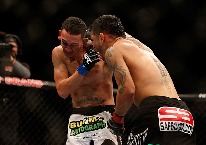LAS VEGAS, NV - DECEMBER 29:  (R-L) Leonard Garcia punches Max Holloway during their featherweight fight at UFC 155 on December 29, 2012 at MGM Grand Garden Arena in Las Vegas, Nevada. (Photo by Josh Hedges/Zuffa LLC/Zuffa LLC via Getty Images) *** Local Caption *** Leonard Garcia; Max Holloway