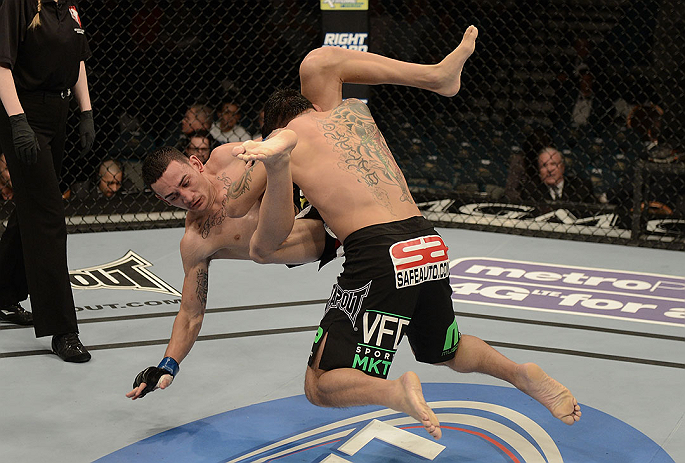 LAS VEGAS, NV - DECEMBER 29:  (R-L) Leonard Garcia slams Max Holloway during their featherweight fight at UFC 155 on December 29, 2012 at MGM Grand Garden Arena in Las Vegas, Nevada. (Photo by Donald Miralle/Zuffa LLC/Zuffa LLC via Getty Images) *** Local Caption *** Leonard Garcia; Max Holloway