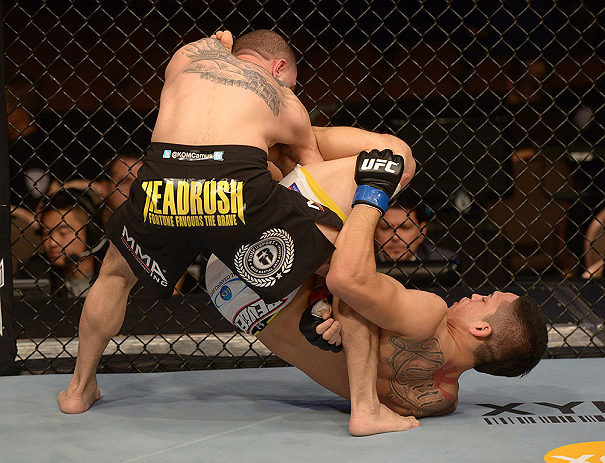 LAS VEGAS, NV - FEBRUARY 02: (R-L) Dustin Kimura attempts to submit Chico Camus during their bantamweight fight at UFC 156 on February 2, 2013 at the Mandalay Bay Events Center in Las Vegas, Nevada. (Photo by Donald Miralle/Zuffa LLC/Zuffa LLC via Getty Images) *** Local Caption *** Chico Camus; Dustin Kimura