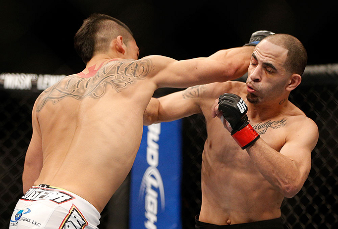 LAS VEGAS, NV - FEBRUARY 02: (L-R) Dustin Kimura punches Chico Camus during their bantamweight fight at UFC 156 on February 2, 2013 at the Mandalay Bay Events Center in Las Vegas, Nevada. (Photo by Josh Hedges/Zuffa LLC/Zuffa LLC via Getty Images) *** Local Caption *** Chico Camus; Dustin Kimura