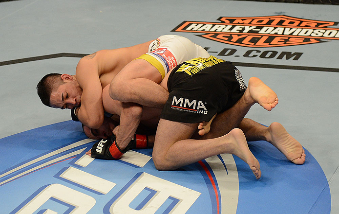 LAS VEGAS, NV - FEBRUARY 02: Dustin Kimura (top) attempts to submit Chico Camus during their bantamweight fight at UFC 156 on February 2, 2013 at the Mandalay Bay Events Center in Las Vegas, Nevada. (Photo by Donald Miralle/Zuffa LLC/Zuffa LLC via Getty Images) *** Local Caption *** Chico Camus; Dustin Kimura