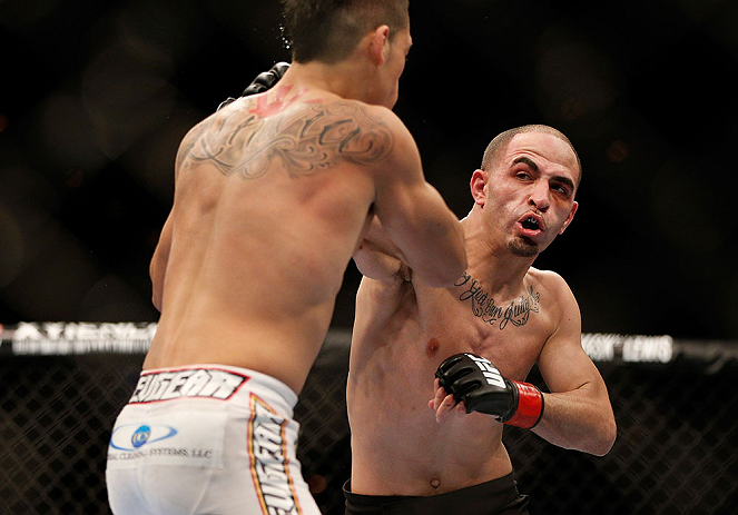 LAS VEGAS, NV - FEBRUARY 02: (R-L) Chico Camus punches Dustin Kimura during their bantamweight fight at UFC 156 on February 2, 2013 at the Mandalay Bay Events Center in Las Vegas, Nevada. (Photo by Josh Hedges/Zuffa LLC/Zuffa LLC via Getty Images) *** Local Caption *** Chico Camus; Dustin Kimura