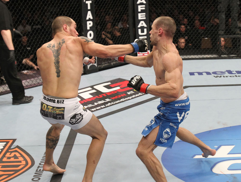 OMAHA, NE - FEBRUARY 15: (L-R) Justin Salas punches Anton Kuivanen during the UFC on FUEL TV event at Omaha Civic Auditorium on February 15, 2012 in Omaha, Nebraska. (Photo by Josh Hedges/Zuffa LLC/Zuffa LLC via Getty Images) *** Local Caption *** Anton Kuivanen; Justin Salas