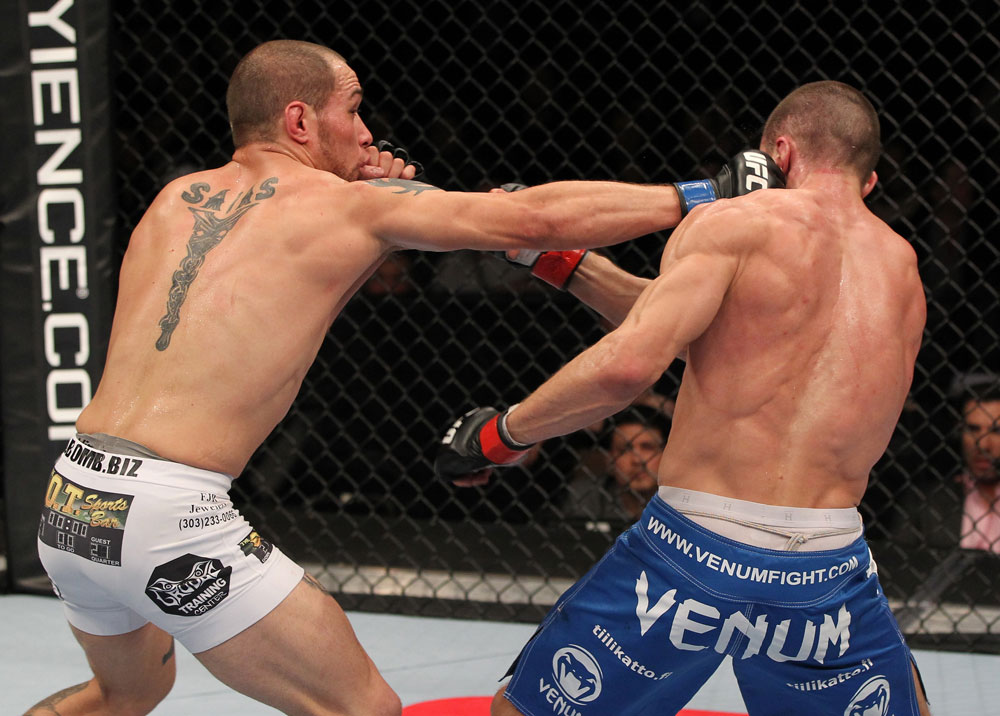 OMAHA, NE - FEBRUARY 15: (L-R) Justin Salas punches Anton Kuivanen during the UFC on FUEL TV event at Omaha Civic Auditorium on February 15, 2012 in Omaha, Nebraska. (Photo by Josh Hedges/Zuffa LLC/Zuffa LLC via Getty Images) *** Local Caption *** Anton Kuivanen; Justin Salas
