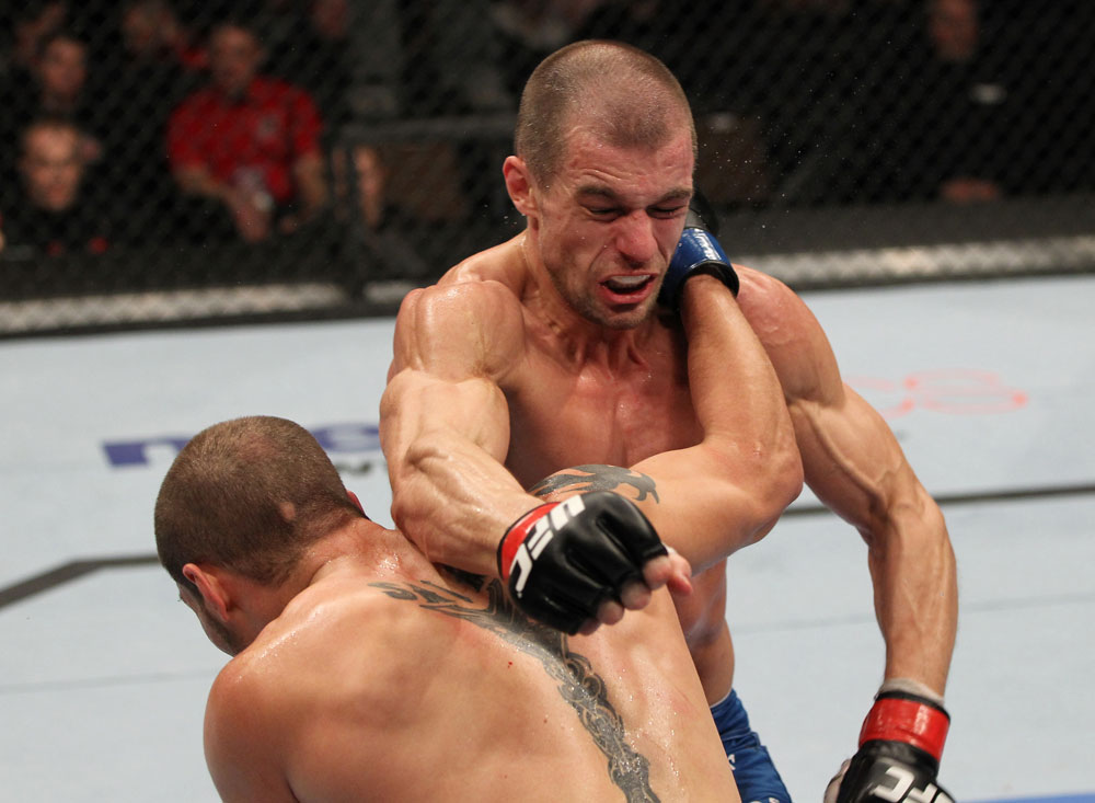 OMAHA, NE - FEBRUARY 15:  (L-R) Justin Salas and Anton Kuivanen trade punches during the UFC on FUEL TV event at Omaha Civic Auditorium on February 15, 2012 in Omaha, Nebraska.  (Photo by Josh Hedges/Zuffa LLC/Zuffa LLC via Getty Images) *** Local Caption *** Anton Kuivanen; Justin Salas
