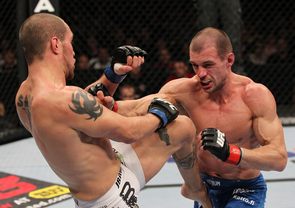 OMAHA, NE - FEBRUARY 15: (L-R) Justin Salas and Anton Kuivanen trade strikes during the UFC on FUEL TV event at Omaha Civic Auditorium on February 15, 2012 in Omaha, Nebraska. (Photo by Josh Hedges/Zuffa LLC/Zuffa LLC via Getty Images) *** Local Caption *** Anton Kuivanen; Justin Salas