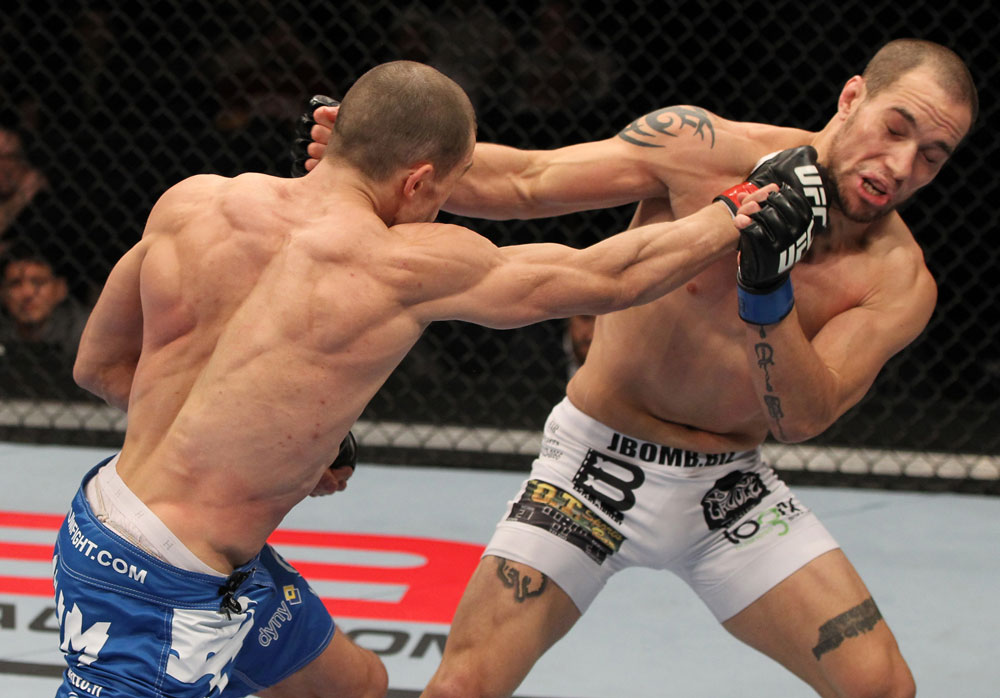 OMAHA, NE - FEBRUARY 15: (L-R) Anton Kuivanen punches Justin Salas during the UFC on FUEL TV event at Omaha Civic Auditorium on February 15, 2012 in Omaha, Nebraska. (Photo by Josh Hedges/Zuffa LLC/Zuffa LLC via Getty Images) *** Local Caption *** Anton Kuivanen; Justin Salas