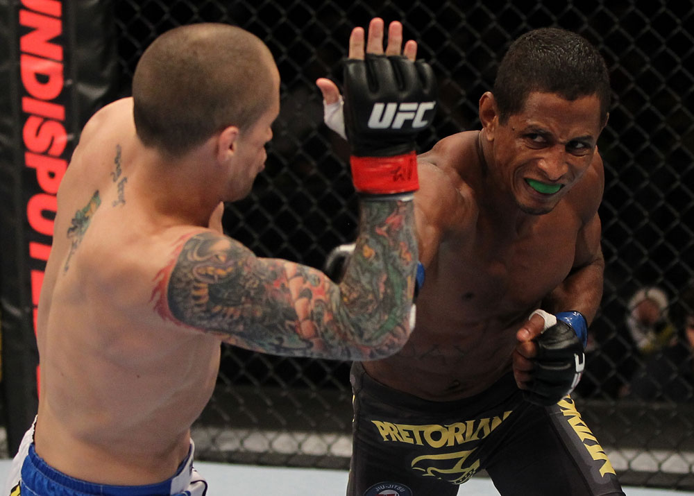 FAIRFAX, VA - MAY 15:  (R-L) Johnny Eduardo punches Jeff Curran in a bantamweight bout during the UFC on Fuel TV event at Patriot Center on May 15, 2012 in Fairfax, Virginia.  (Photo by Josh Hedges/Zuffa LLC/Zuffa LLC via Getty Images)