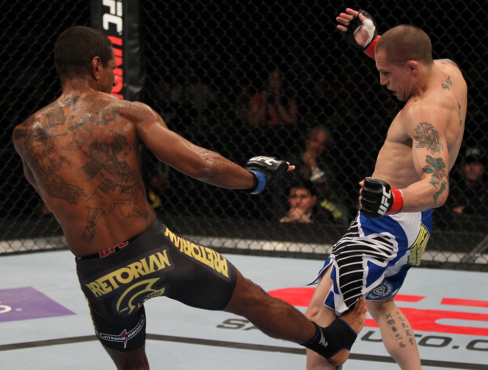 FAIRFAX, VA - MAY 15:  (L-R) Johnny Eduardo kicks Jeff Curran in a bantamweight bout during the UFC on Fuel TV event at Patriot Center on May 15, 2012 in Fairfax, Virginia.  (Photo by Josh Hedges/Zuffa LLC/Zuffa LLC via Getty Images)