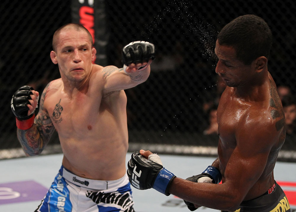 FAIRFAX, VA - MAY 15:  (L-R) Jeff Curran punches Johnny Eduardo in a bantamweight bout during the UFC on Fuel TV event at Patriot Center on May 15, 2012 in Fairfax, Virginia.  (Photo by Josh Hedges/Zuffa LLC/Zuffa LLC via Getty Images)