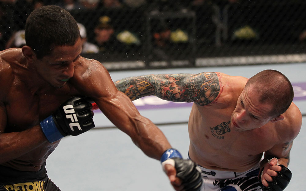 FAIRFAX, VA - MAY 15:  (R-L) Jeff Curran and Johnny Eduardo trade punches in a bantamweight bout during the UFC on Fuel TV event at Patriot Center on May 15, 2012 in Fairfax, Virginia.  (Photo by Josh Hedges/Zuffa LLC/Zuffa LLC via Getty Images)