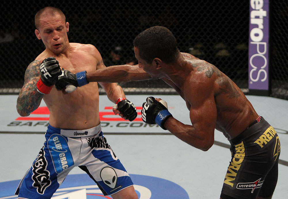 FAIRFAX, VA - MAY 15:  (R-L) Johnny Eduardo punches Jeff Curran in a bantamweight bout during the UFC on Fuel TV event at Patriot Center on May 15, 2012 in Fairfax, Virginia.  (Photo by Josh Hedges/Zuffa LLC/Zuffa LLC via Getty Images)