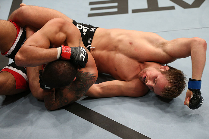NOTTINGHAM, ENGLAND - SEPTEMBER 29: (R-L) Gunnar Nelson punches DaMarques Johnson during their catchweight fight at the UFC on Fuel TV event at Capital FM Arena on September 29, 2012 in Nottingham, England. (Photo by Josh Hedges/Zuffa LLC/Zuffa LLC via Getty Images)