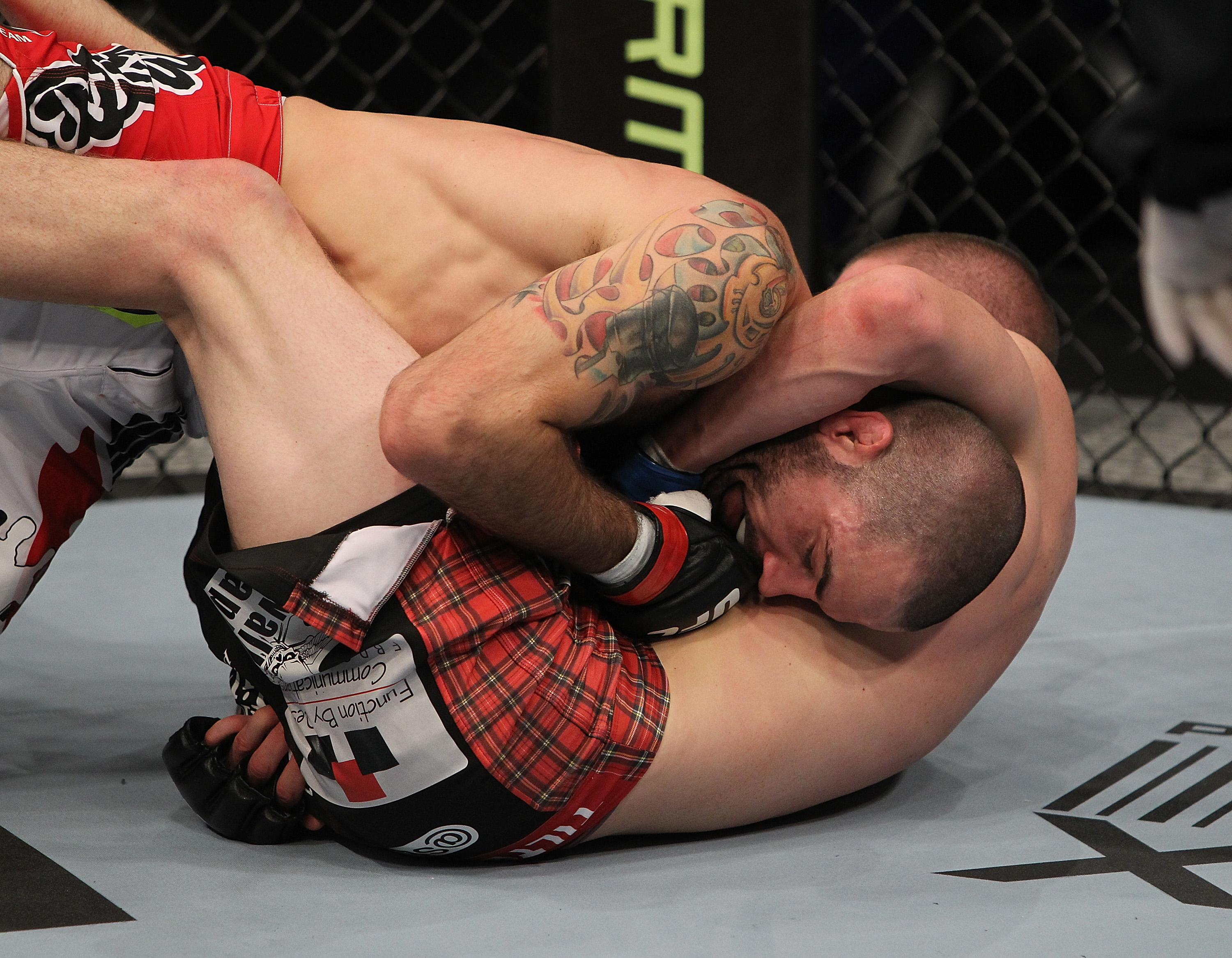 SAN JOSE, CA - NOVEMBER 19: Matt Brown (top) is held in a head-lock by Seth Baczynski (bottom) during an UFC Welterweight bout at the HP Pavillion in San Jose, California on November 19, 2011 in San Jose, California. (Photo by Josh Hedges/Zuffa LLC/Zuffa LLC via Getty Images)