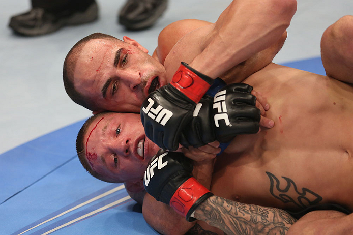 DENVER, CO - AUGUST 11: (R-L) Chico Camus attempts a rear choke submission against Dustin Pague during their bantamweight bout at UFC 150 inside Pepsi Center on August 11, 2012 in Denver, Colorado. (Photo by Nick Laham/Zuffa LLC/Zuffa LLC via Getty Images)