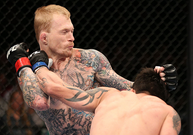 MINNEAPOLIS, MN - OCTOBER 05: (R-L) Diego Nunes punches Bart Palaszewski during their featherweight fight at the UFC on FX event at Target Center on October 5, 2012 in Minneapolis, Minnesota. (Photo by Josh Hedges/Zuffa LLC/Zuffa LLC via Getty Images)