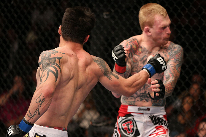 MINNEAPOLIS, MN - OCTOBER 05: (L-R) Diego Nunes punches Bart Palaszewski during their featherweight fight at the UFC on FX event at Target Center on October 5, 2012 in Minneapolis, Minnesota. (Photo by Josh Hedges/Zuffa LLC/Zuffa LLC via Getty Images)