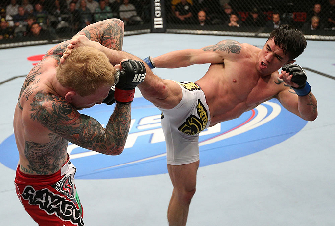 MINNEAPOLIS, MN - OCTOBER 05: (R-L) Diego Nunes kicks Bart Palaszewski during their featherweight fight at the UFC on FX event at Target Center on October 5, 2012 in Minneapolis, Minnesota. (Photo by Josh Hedges/Zuffa LLC/Zuffa LLC via Getty Images)