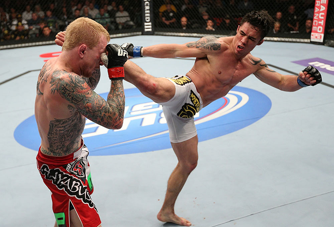 MINNEAPOLIS, MN - OCTOBER 05: (R-L) Diego Nunes kicks Bart Palaszewski during their featherweight fight at the UFC on FX event at Target Center on October 5, 2012 in Minneapolis, Minnesota. (Photo by Josh Hedges/Zuffa LLC/Zuffa LLC via Getty Images)