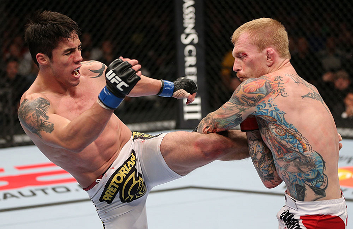 MINNEAPOLIS, MN - OCTOBER 05: (L-R) Diego Nunes kicks Bart Palaszewski during their featherweight fight at the UFC on FX event at Target Center on October 5, 2012 in Minneapolis, Minnesota. (Photo by Josh Hedges/Zuffa LLC/Zuffa LLC via Getty Images)