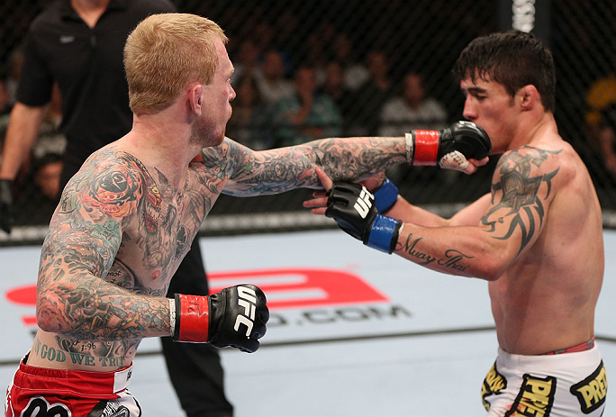 MINNEAPOLIS, MN - OCTOBER 05: (L-R) Bart Palaszewski punches Diego Nunes during their featherweight fight at the UFC on FX event at Target Center on October 5, 2012 in Minneapolis, Minnesota. (Photo by Josh Hedges/Zuffa LLC/Zuffa LLC via Getty Images)