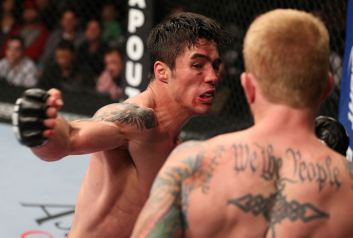 MINNEAPOLIS, MN - OCTOBER 05: (L-R) Diego Nunes punches Bart Palaszewski during their featherweight fight at the UFC on FX event at Target Center on October 5, 2012 in Minneapolis, Minnesota. (Photo by Josh Hedges/Zuffa LLC/Zuffa LLC via Getty Images)