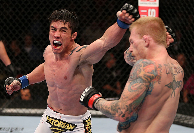 MINNEAPOLIS, MN - OCTOBER 05: (L-R) Diego Nunes punches Bart Palaszewski during their featherweight fight at the UFC on FX event at Target Center on October 5, 2012 in Minneapolis, Minnesota. (Photo by Josh Hedges/Zuffa LLC/Zuffa LLC via Getty Images)