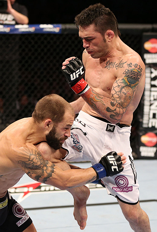 RIO DE JANEIRO, BRAZIL - OCTOBER 13:  (R-L) Rony "Jason" Mariano Bezerra delivers a flying knee strike against Sam Sicilia during their featherweight fight at UFC 153 inside HSBC Arena on October 13, 2012 in Rio de Janeiro, Brazil.  (Photo by Josh Hedges/Zuffa LLC/Zuffa LLC via Getty Images)