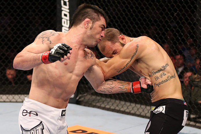 RIO DE JANEIRO, BRAZIL - OCTOBER 13:  (L-R) Rony "Jason" Mariano Bezerra punches Sam Sicilia during their featherweight fight at UFC 153 inside HSBC Arena on October 13, 2012 in Rio de Janeiro, Brazil.  (Photo by Josh Hedges/Zuffa LLC/Zuffa LLC via Getty Images)